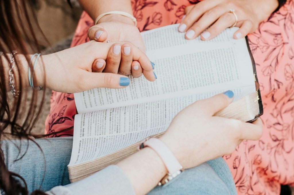 women healing spiritually by reading from bible